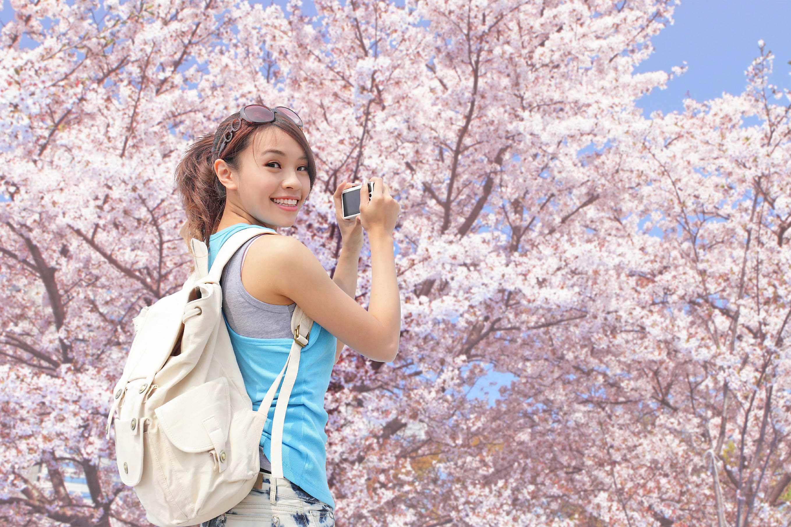 Happy woman traveler take a photo